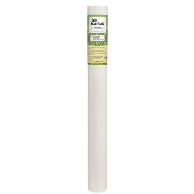 Disposable white waxing table paper roll on treatment bed for spa and salon use