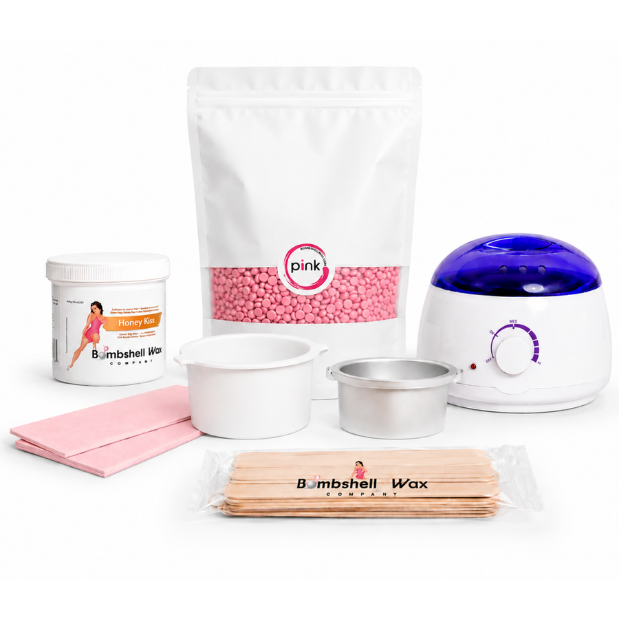 Kit with Bombshell pink depilatory hard wax, soft wax, wax warmer, wax sticks, wax strips, and an empty hard wax tin